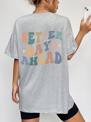 Gray oversized graphic tee with retro "Better Days Ahead" text in pastel colors.
