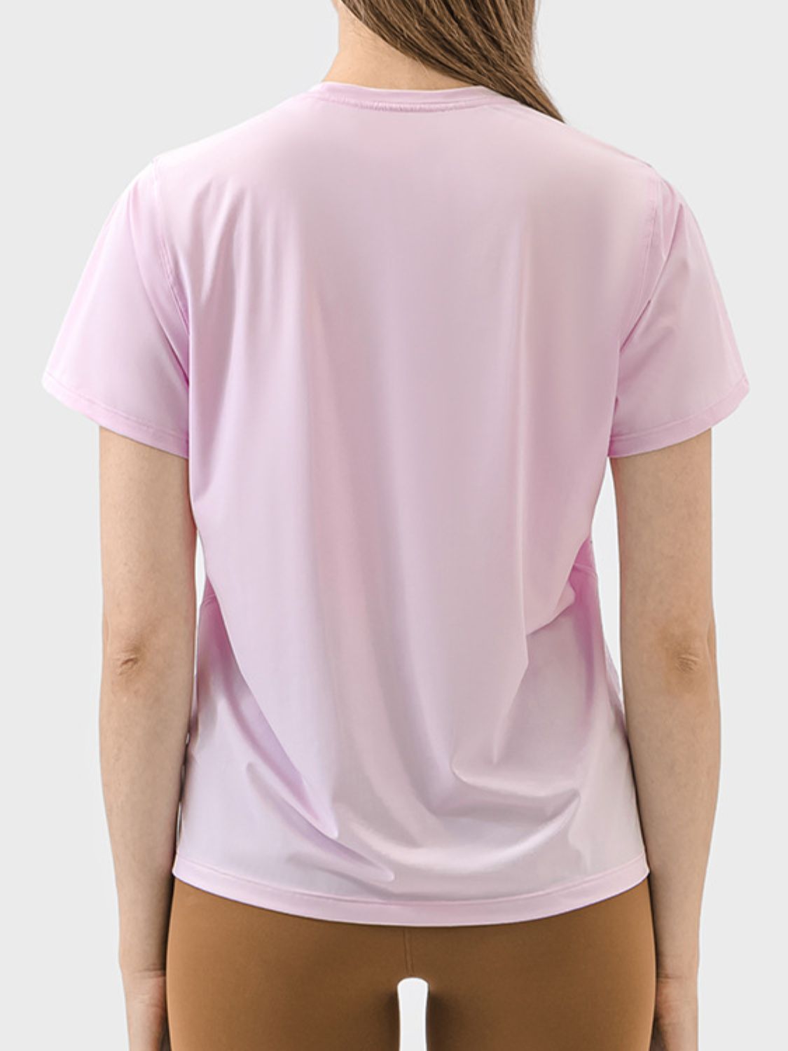 Performance tee in blush pink with short sleeves and a crew neck, showing the back view.
