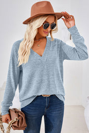 Light blue relaxed v-neck long sleeve tunic top with a heathered texture.