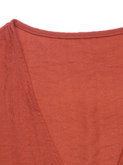 Terracotta linen lounge set top detail with V-neckline and visible stitching