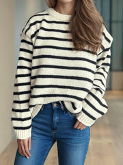 Breton stripe relaxed knit sweater in white with black stripes, crew neck, long sleeves.