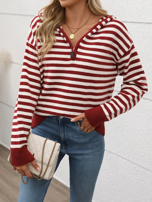 Striped zip-neck hooded knit sweater in burgundy and white acrylic with a quarter zip.