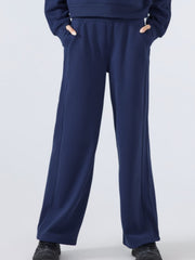 Dark blue relaxed palazzo sweatpants with drawstring waist and pockets.