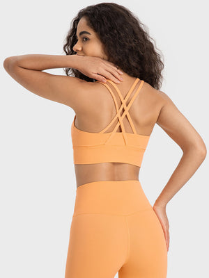 Orange performance bra with crisscross back straps and wide band