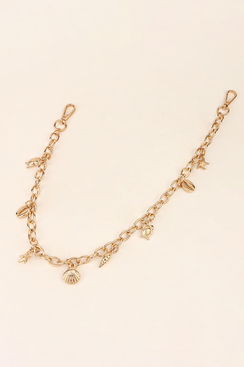 Gold chain belt with seashell, starfish, and turtle charms