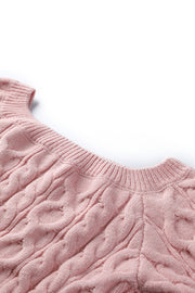 Blush pink cable knit cropped off-the-shoulder sweater with ribbed neckline detail.