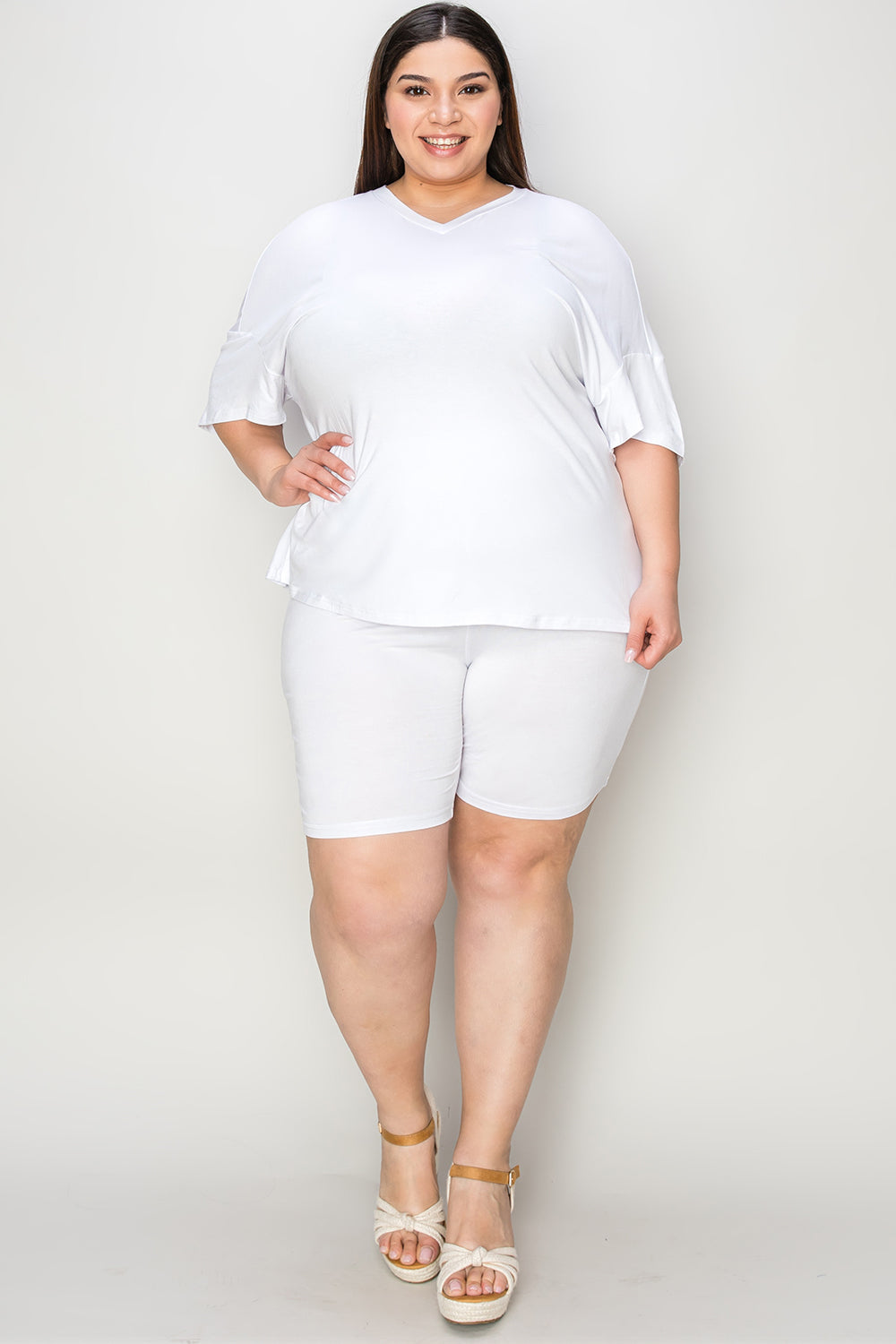 White bamboo loungewear set with relaxed fit V-neck tee and biker shorts.