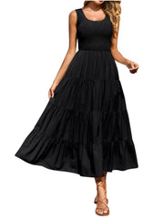 Black smocked bodice ruffled maxi dress with tiered skirt and scoop neck.