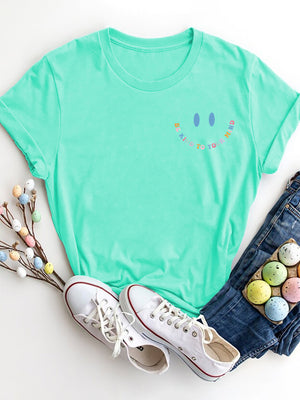 Aqua vintage wash t-shirt with smiley face graphic and colorful text Be Kind To Your Mind.