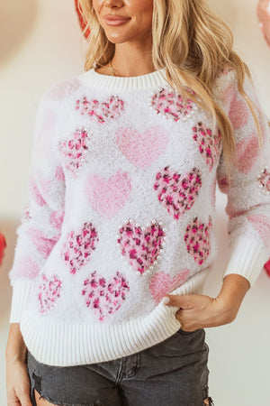 Fuzzy heart jacquard knit sweater in blush pink with pearl embellishments.