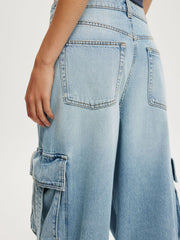 Light blue denim maternity cargo jeans with vintage wash and ankle length.