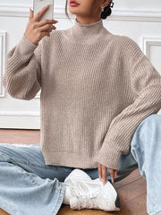 Relaxed fit ribbed knit turtleneck sweater in beige acrylic with balloon sleeves.