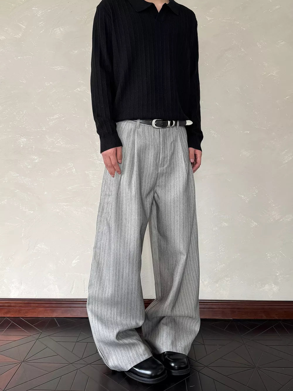 Relaxed wide-leg grey pinstripe sweatpants with a comfortable fit.