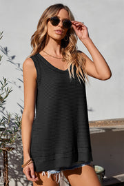 Black waffle knit tank top with asymmetric hem and V-neck.