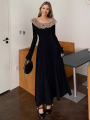 Black a-line dress with lace collar and bell cuffs, ankle length