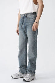 Relaxed fit medium wash straight leg denim jeans with a casual style.