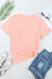Watermelon pink basic t-shirt with rolled sleeves and a knotted hem.