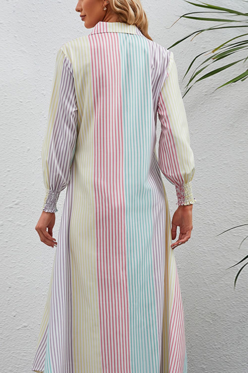 Shirtdress with vertical stripes and smocked cuffs.