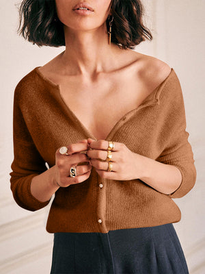 Brown cashmere cardigan with plunging neckline and button detail.