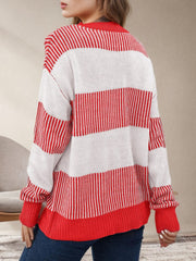 Crewneck sweater with red and white stripes, knit material, long sleeves.