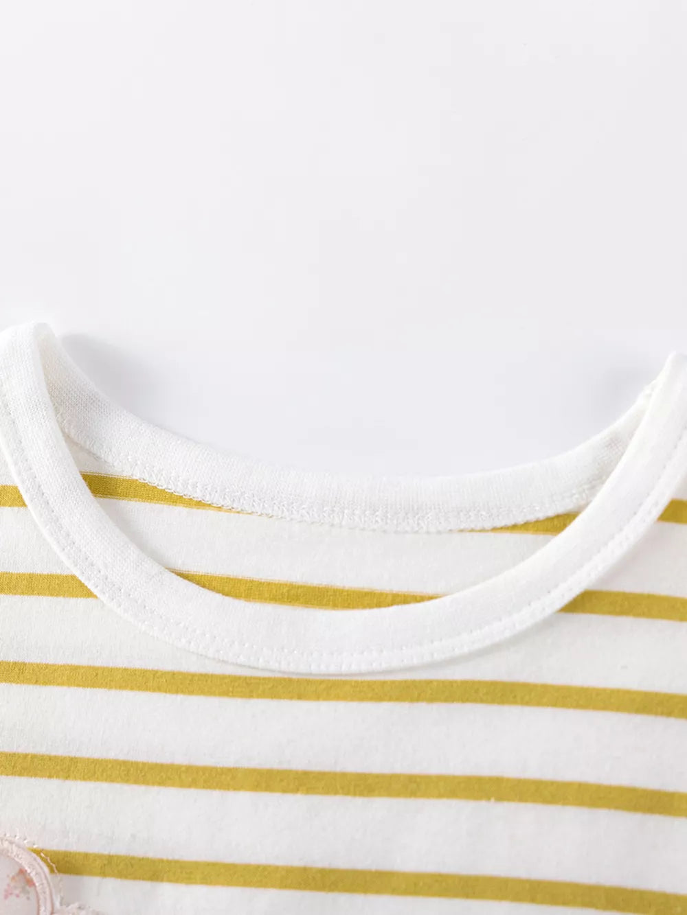 Baby girls' white and gold striped cotton top with ruffled applique detail.