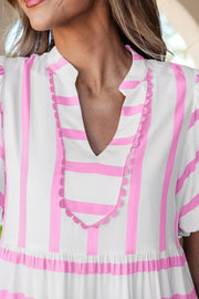 White and pink striped maxi dress with notched neckline and scalloped trim.