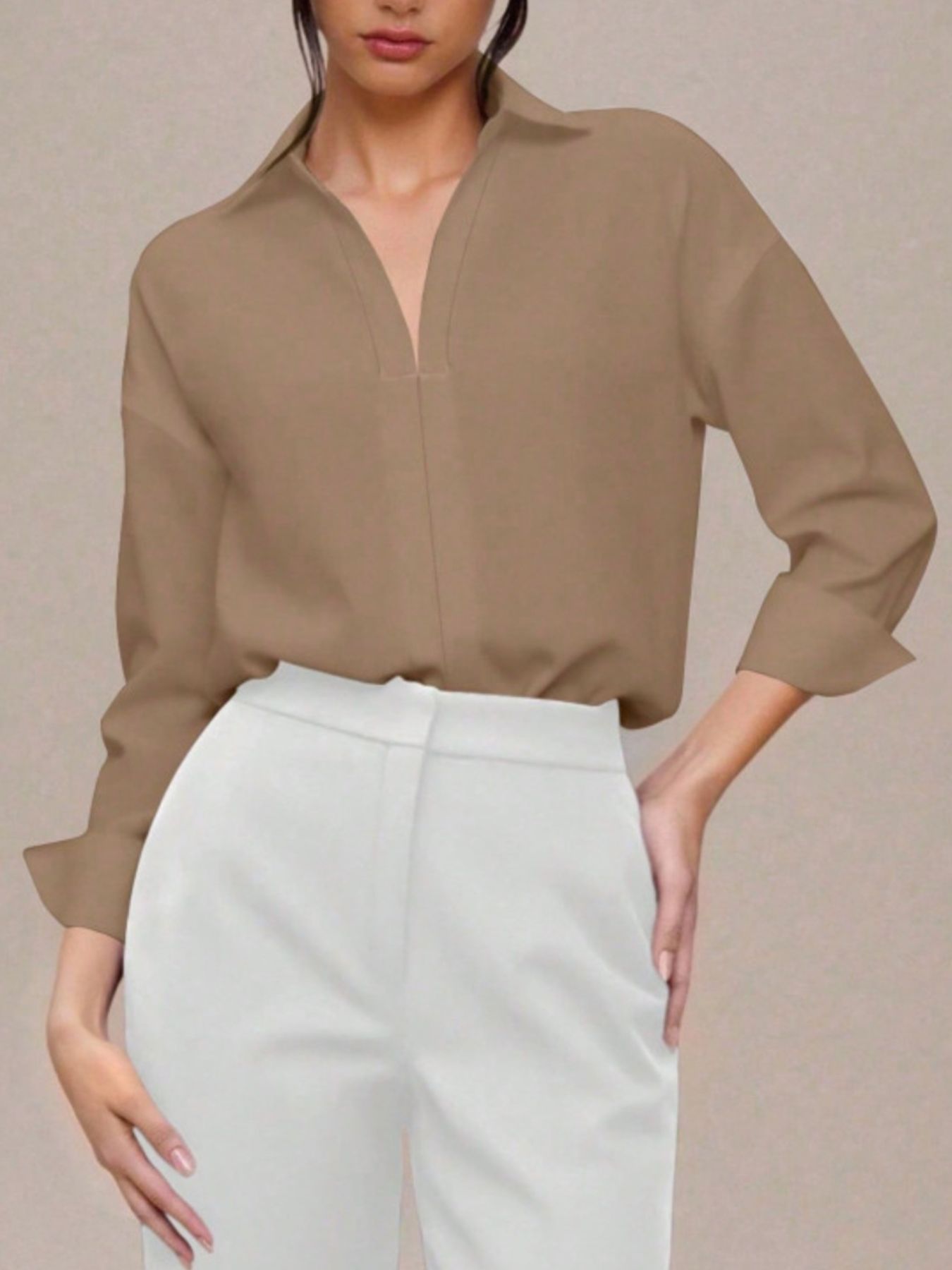 Khaki long sleeve collared bodysuit with a deep V-neckline, cuffed sleeves.