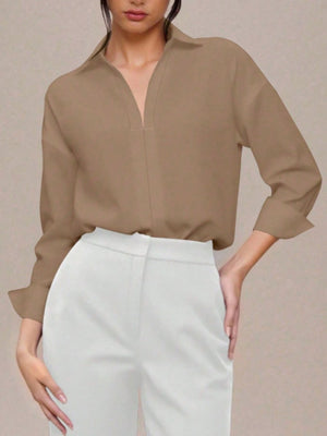 Khaki long sleeve collared bodysuit with a deep V-neckline, cuffed sleeves.