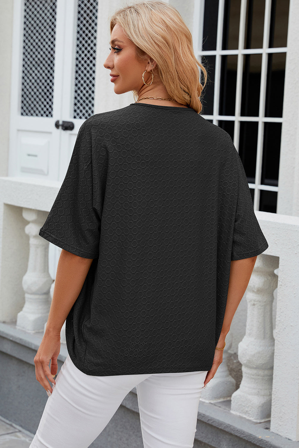 Black open-front kimono sleeve top with textured pattern and short sleeves.