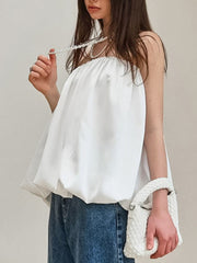 White strapless bubble hem blouse with a gathered neckline.