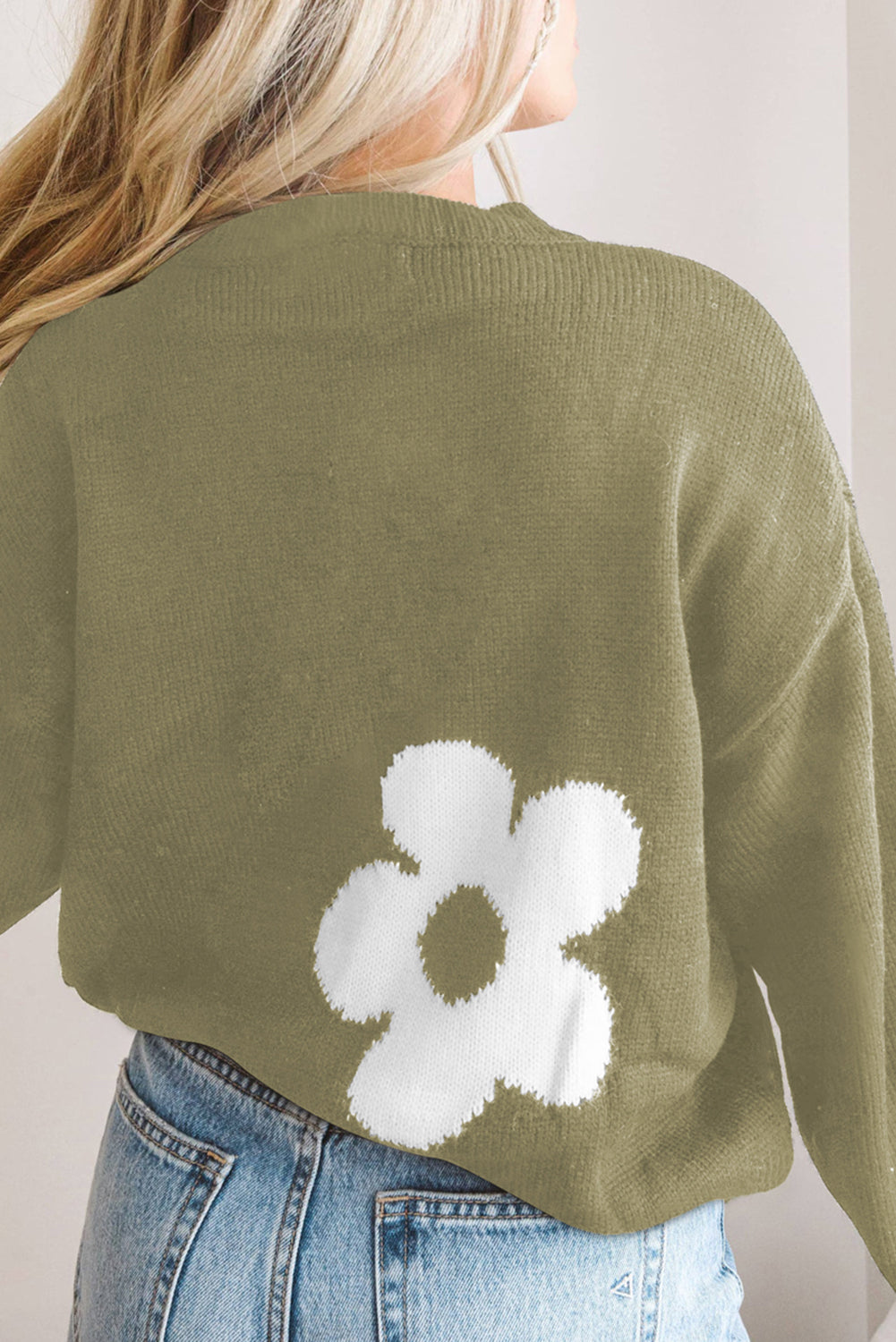 Sage acrylic crewneck sweater with a white floral intarsia knit detail on the back.