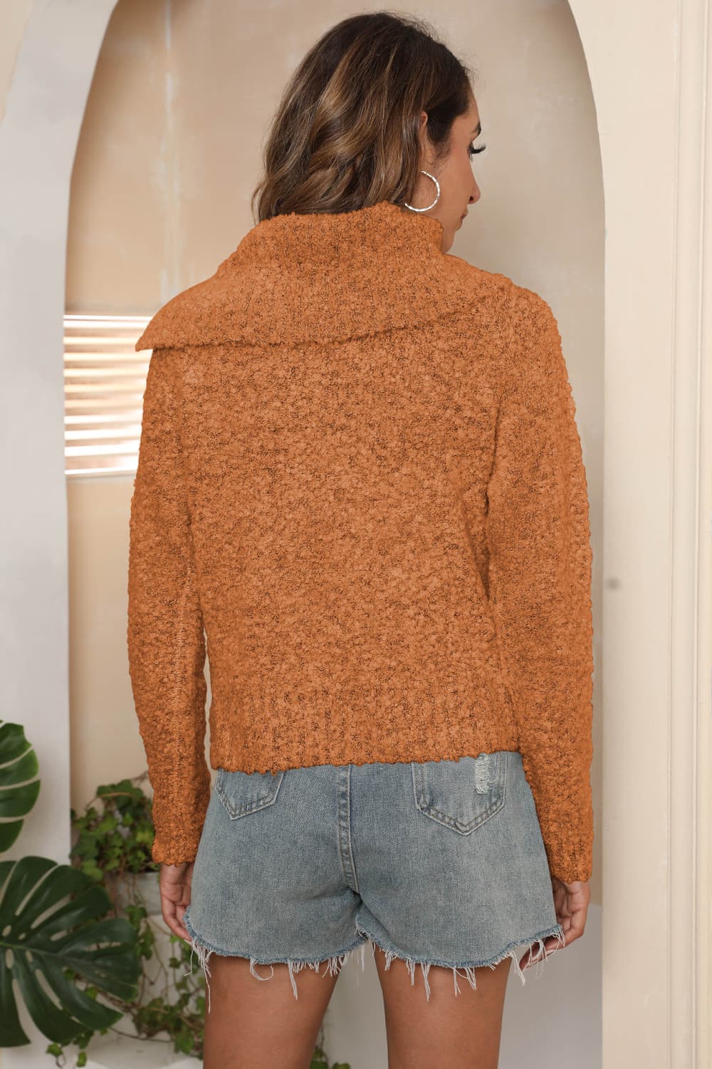 Caramel textured knit sweater with asymmetric collar, long sleeves and casual fit.