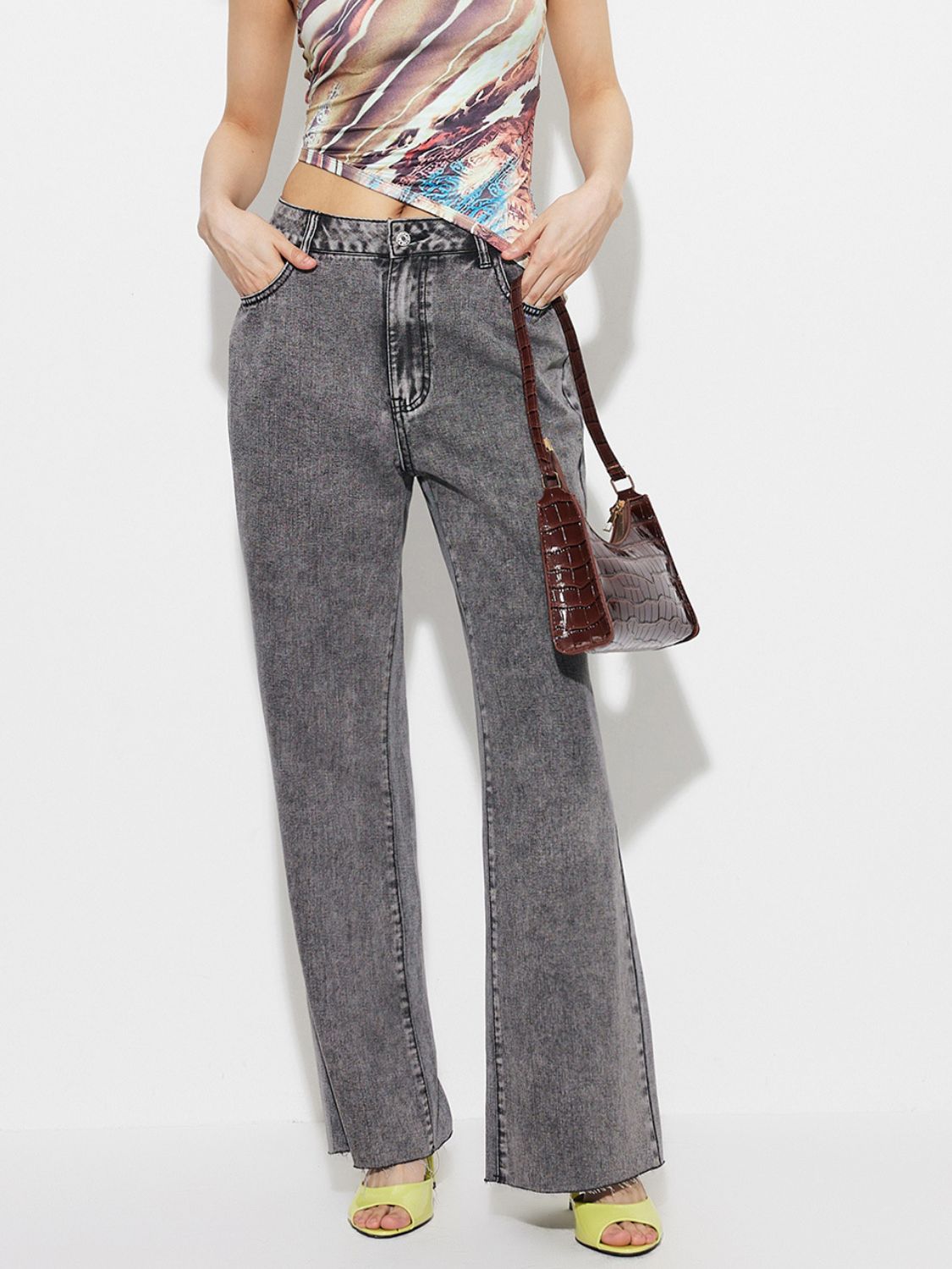 Acid wash flare jeans in dark gray, high-rise cotton denim with a buttoned waist.