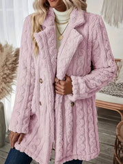 Pink faux shearling double-breasted coat with cable knit texture and button closure.