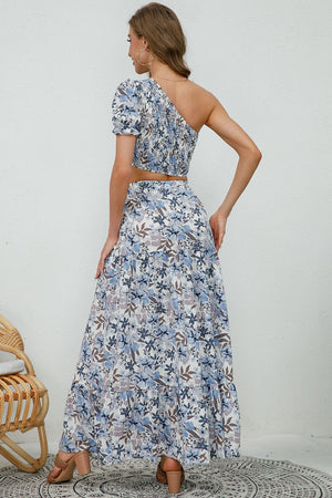 Floral one-shoulder crop top and tiered slit maxi skirt set with puff sleeves.
