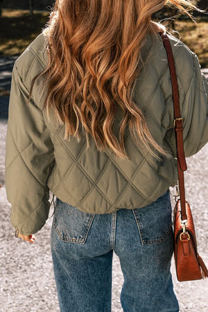 Sage quilted utility jacket with diamond stitching and a shearling collar detail.