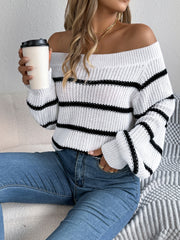 Off-the-shoulder striped knit pullover sweater in white with black stripes, acrylic material.