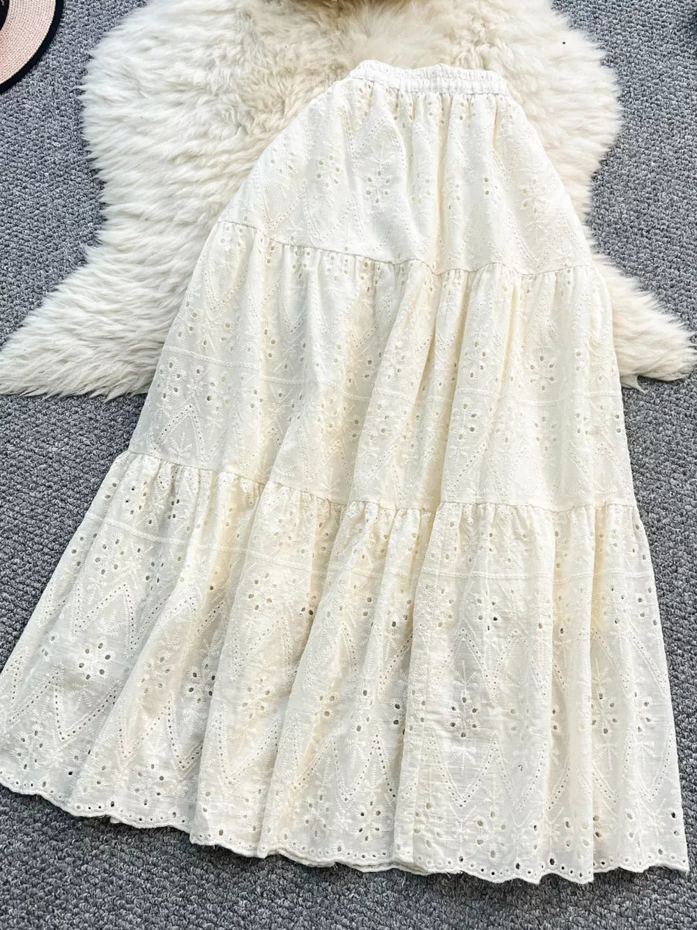 White eyelet maxi skirt with tiered ruffles and elastic waistband