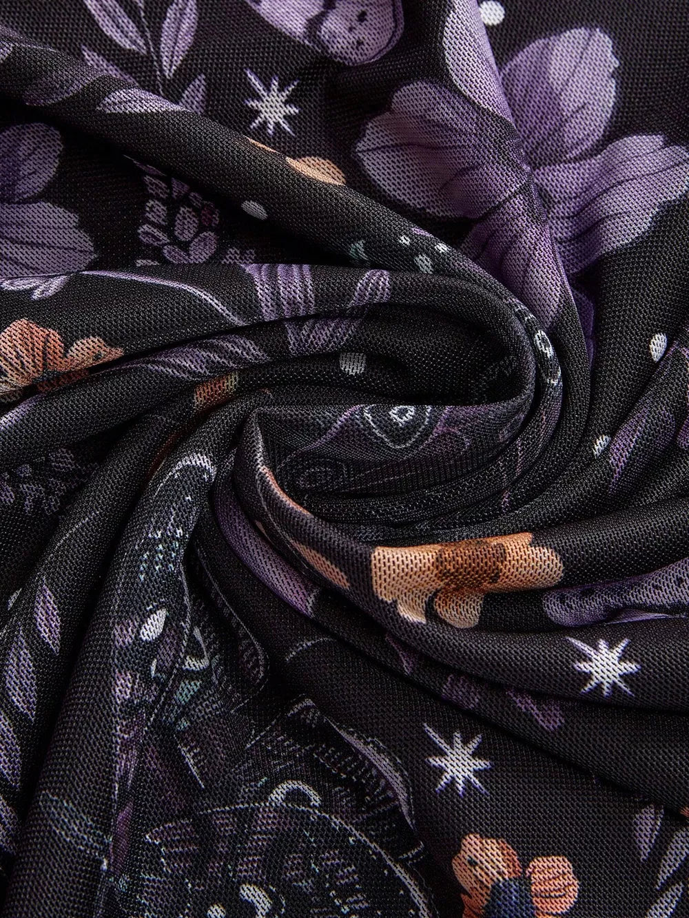 Black mesh midi skirt with a whimsical floral and butterfly print in purple and orange.