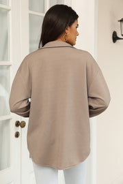 Textured overshirt in Khaki with a geometric pattern, long sleeves, and collar.