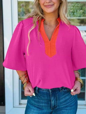 Textured pink blouse with orange V-neck detail and half sleeves