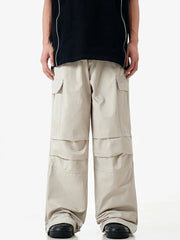 Apricot cargo sweatpants with multiple pockets and layered detailing.