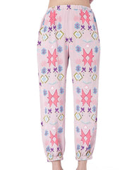 Women's blush pink lounge pants with abstract geometric print and elastic cuffs.