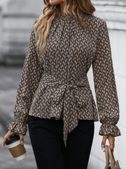 Khaki patterned blouse with tie waist and ruffled flounce sleeves.