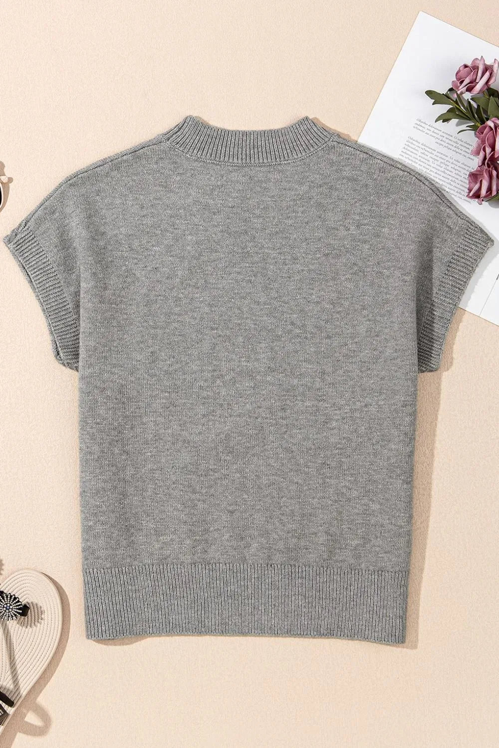 Gray knit top with mock neck and short sleeves, ribbed hem and cuffs