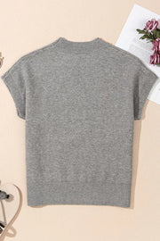 Gray knit top with mock neck and short sleeves, ribbed hem and cuffs