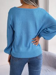 Azure cable knit sweater with square neckline and balloon sleeves.