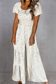 White floral smocked bodice wide-leg jumpsuit with puff sleeves and tiered hem