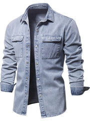Light faded denim utility shirt jacket with buttoned chest pockets and collar.