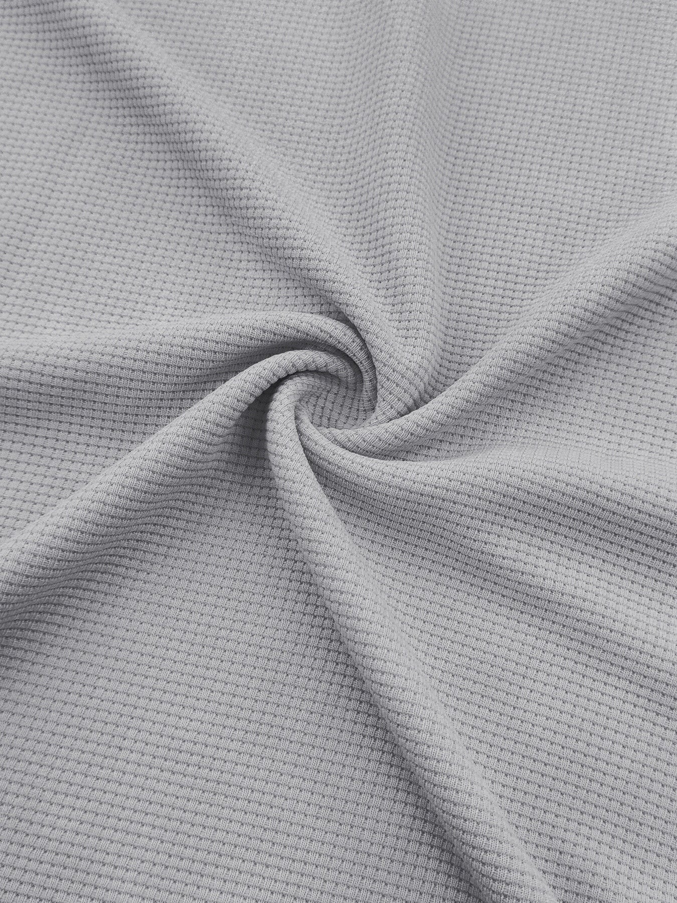 Light gray textured waffle knit fabric detail of joggers